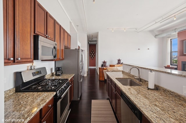 1524 S Sangamon St Unit 802, Chicago, IL 60608 - kitchen with stainless steel appliances, light stone countertops, dark wood finished floors, and rail lighting