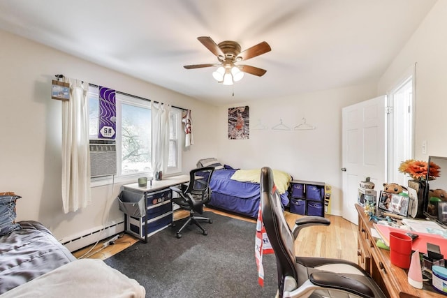 1555 Monroe Ave Unit 2, River Forest, IL 60305 - bedroom with wood finished floors, baseboard heating, a desk, and a ceiling fan