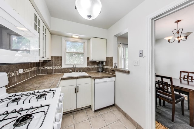 1555 Monroe Ave Unit 2, River Forest, IL 60305 - kitchen featuring white appliances, white cabinetry, backsplash, glass insert cabinets, and tile counters