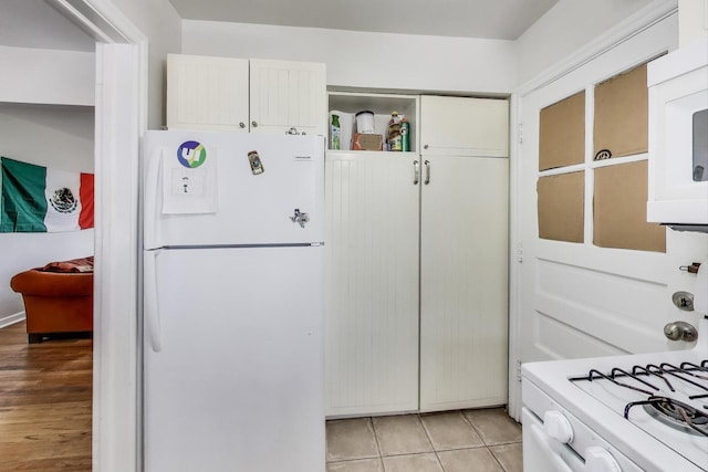 1555 Monroe Ave Unit 2, River Forest, IL 60305 - kitchen with white appliances, white cabinetry, and open shelves