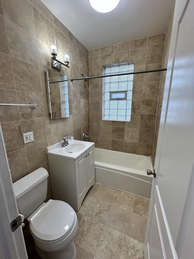 3707 W Altgeld St Unit 1, Chicago, IL 60647 - bathroom featuring vanity,  shower combination, stone finish floors, and tile walls