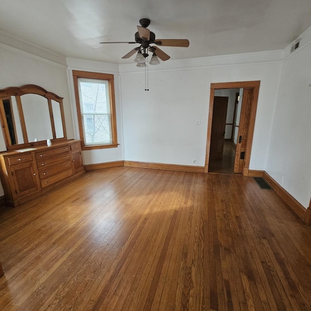 3054 N Kedzie Ave Unit 1F, Chicago, IL 60618 - unfurnished room with wood-type flooring, ceiling fan, and crown molding