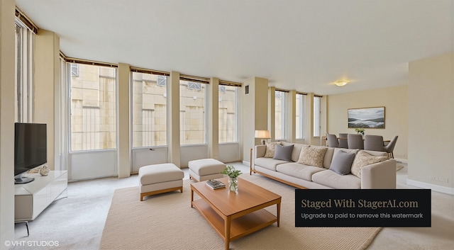 100 E Walton St Unit 14D, Chicago, IL 60611 - living room featuring light colored carpet and plenty of natural light