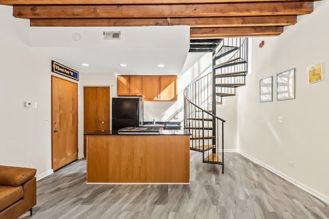 7349 Madison St Unit C, Forest Park, IL 60130 - kitchen with beamed ceiling, dark countertops, freestanding refrigerator, recessed lighting, and a center island