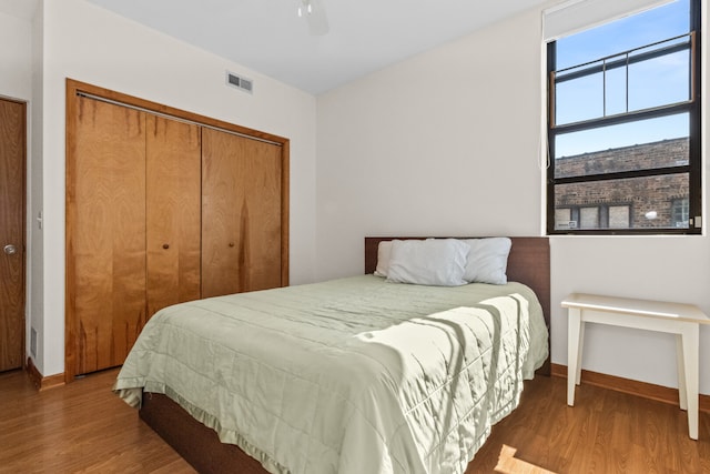 7349 Madison St Unit C, Forest Park, IL 60130 - bedroom with wood finished floors, a closet, and a ceiling fan