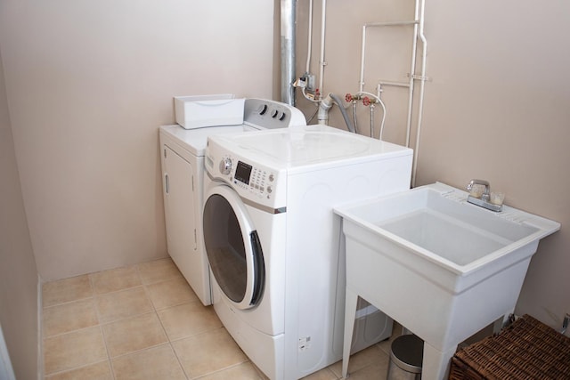 5451 Elizabeth Pl Unit 0, Rolling Meadows, IL 60008 - laundry room featuring washer and clothes dryer and light tile patterned flooring