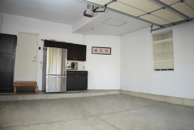 5451 Elizabeth Pl Unit 0, Rolling Meadows, IL 60008 - garage with freestanding refrigerator and a garage door opener