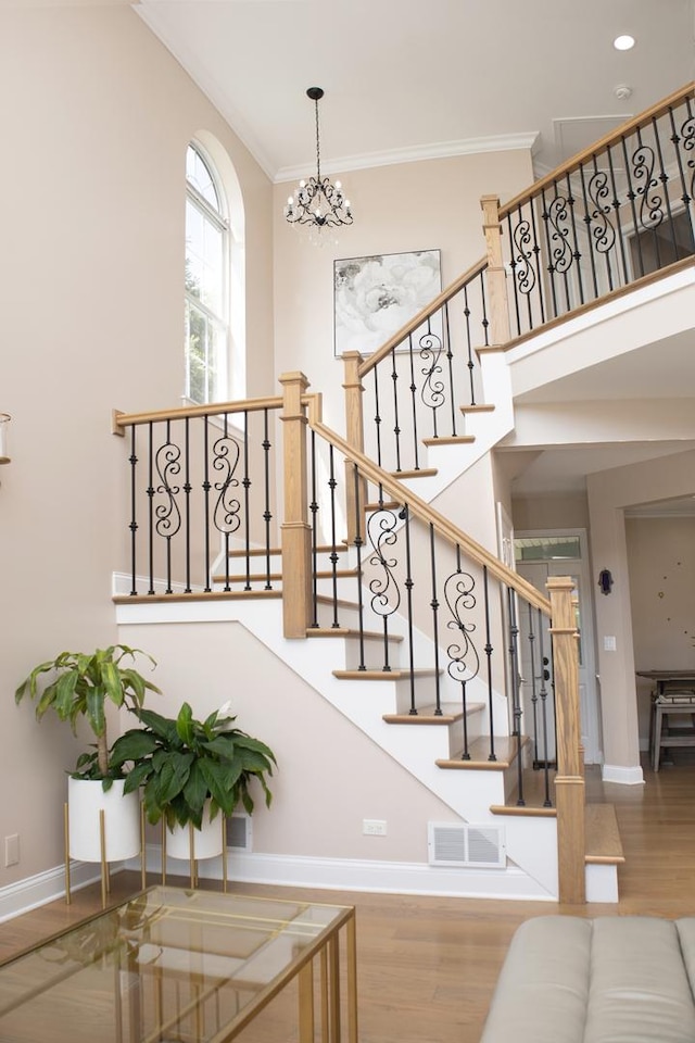 5451 Elizabeth Pl Unit 0, Rolling Meadows, IL 60008 - stairway with wood finished floors, a chandelier, and ornamental molding