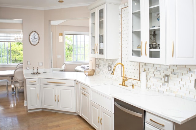 5451 Elizabeth Pl Unit 0, Rolling Meadows, IL 60008 - kitchen with stainless steel dishwasher, ornamental molding, tasteful backsplash, white cabinets, and light wood-style floors