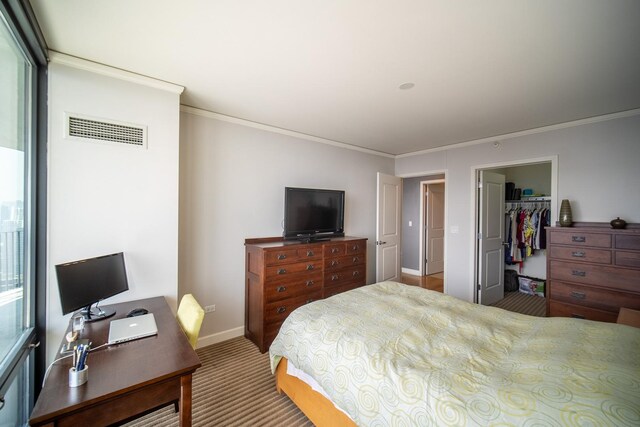 225 N Columbus Dr Unit 7207, Chicago, IL 60601 - bedroom featuring crown molding, carpet, a spacious closet, and a desk