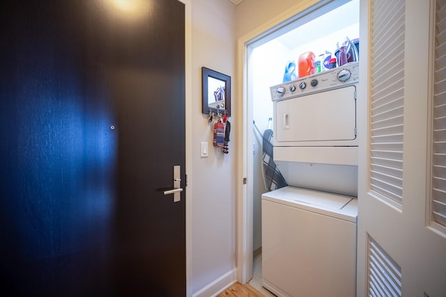225 N Columbus Dr Unit 7207, Chicago, IL 60601 - washroom with stacked washer and clothes dryer and light wood-style floors