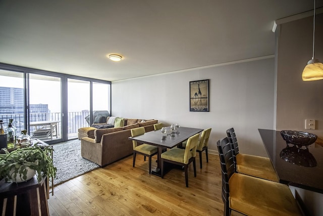225 N Columbus Dr Unit 7207, Chicago, IL 60601 - living room featuring light wood-type flooring, crown molding, and floor to ceiling windows