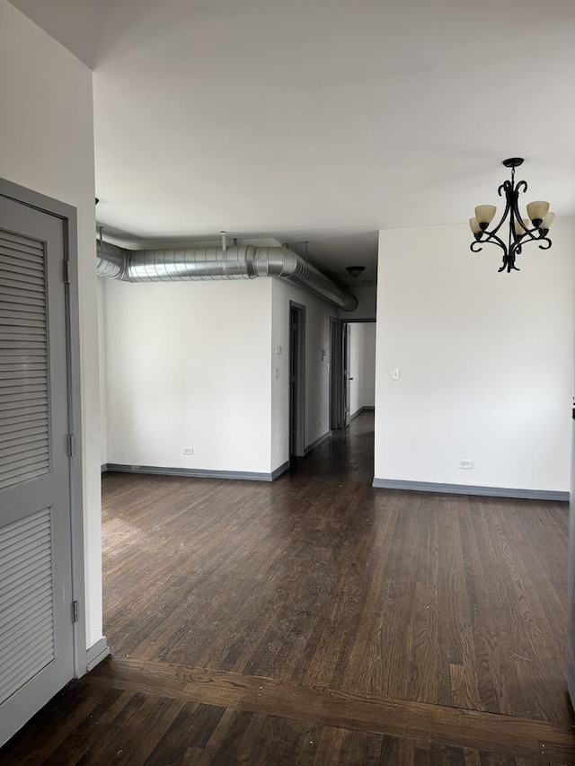 1531 S Kolin Ave, Chicago, IL 60623 - spare room with a chandelier and wood finished floors