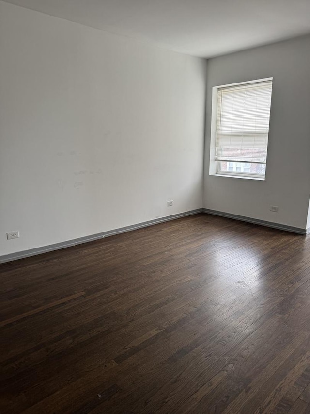 1531 S Kolin Ave, Chicago, IL 60623 - spare room featuring dark wood-style floors