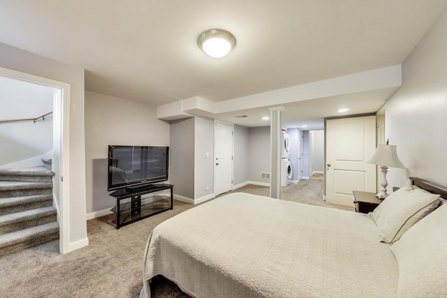 1949 N Whipple St Unit 1, Chicago, IL 60647 - bedroom featuring stacked washing machine and dryer and light colored carpet