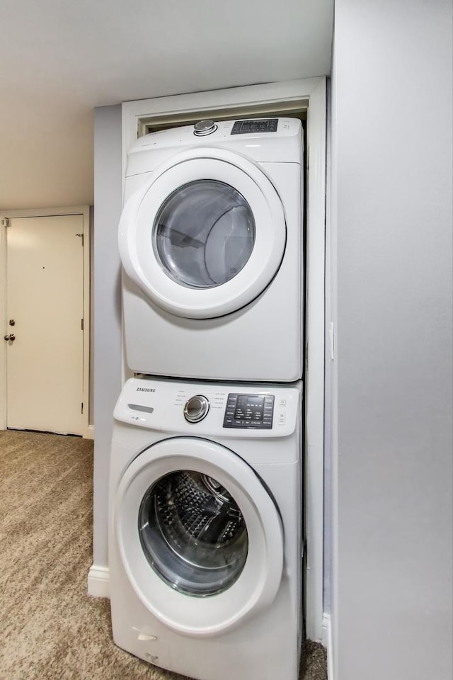 1949 N Whipple St Unit 1, Chicago, IL 60647 - laundry area featuring stacked washer / drying machine and carpet