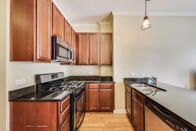 1949 N Whipple St Unit 1, Chicago, IL 60647 - kitchen featuring stainless steel appliances, light wood finished floors, crown molding, dark stone counters, and pendant lighting