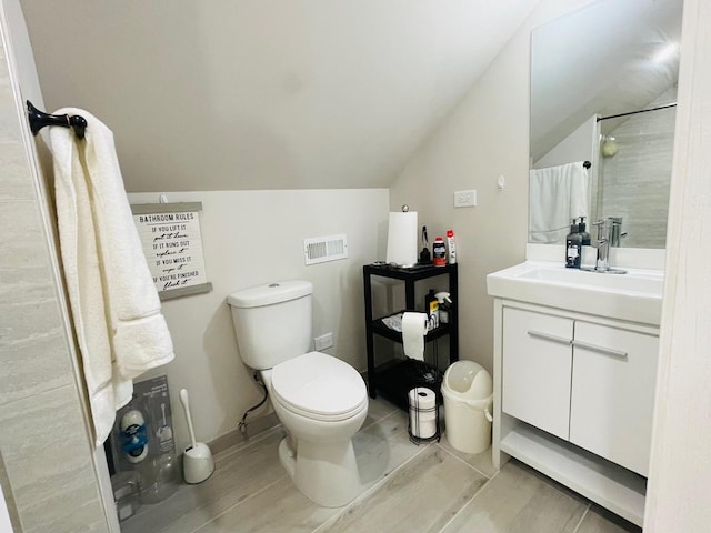 4623 S Harding Ave, Chicago, IL 60632 - bathroom with vanity, lofted ceiling, and a shower