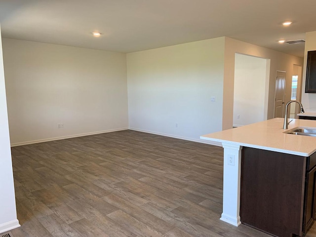 2296 Laurel Ct, Wonder Lake, IL 60097 - kitchen with dark wood finished floors, light countertops, dark brown cabinetry, recessed lighting, and open floor plan