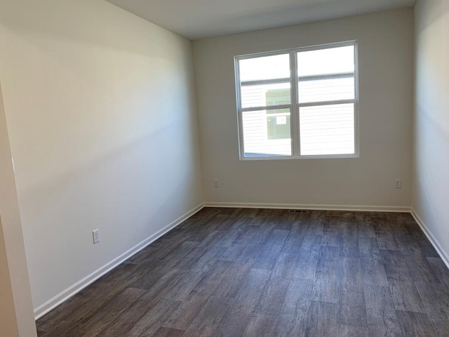 2296 Laurel Ct, Wonder Lake, IL 60097 - empty room with dark wood finished floors and baseboards