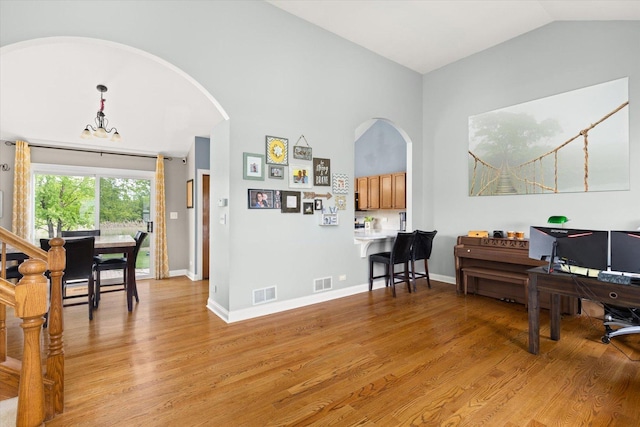 25516 W Gateway Cir, Plainfield, IL 60585 - office area featuring arched walkways, light wood finished floors, and lofted ceiling
