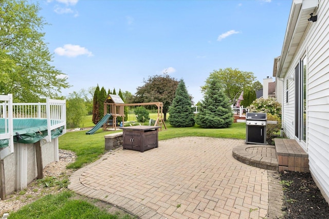 25516 W Gateway Cir, Plainfield, IL 60585 - view of patio / terrace with a playground and grilling area