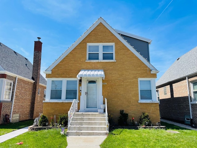 5410 S Harding Ave, Chicago, IL 60632 - bungalow with brick siding and a front lawn