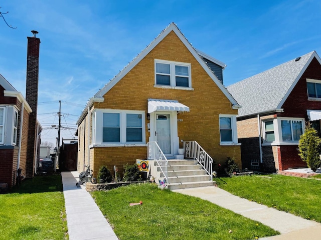 5410 S Harding Ave, Chicago, IL 60632 - view of front of home featuring brick siding and a front lawn