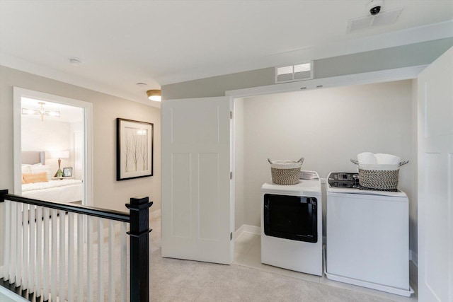 25452 W Stockwell Dr, Plainfield, IL 60544 - laundry room with washing machine and clothes dryer and light colored carpet