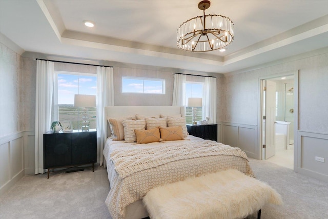 25452 W Stockwell Dr, Plainfield, IL 60544 - bedroom featuring light carpet, a raised ceiling, a chandelier, a decorative wall, and a wainscoted wall
