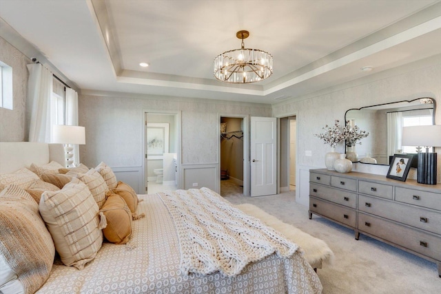 25452 W Stockwell Dr, Plainfield, IL 60544 - bedroom with a chandelier, a tray ceiling, a walk in closet, and connected bathroom