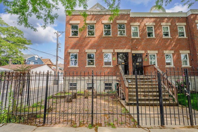 1166 W Cullerton St, Chicago, IL 60608 - view of front of home featuring a fenced front yard and brick siding