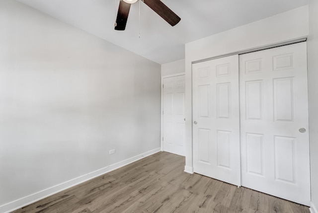 1166 W Cullerton St, Chicago, IL 60608 - unfurnished bedroom with light wood finished floors, a closet, lofted ceiling, and a ceiling fan