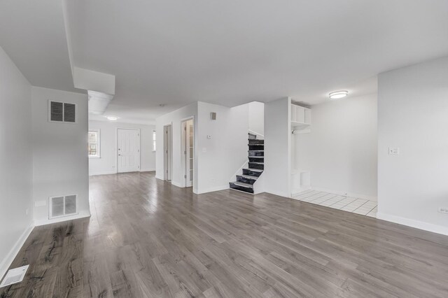 1166 W Cullerton St, Chicago, IL 60608 - unfurnished living room featuring stairs and wood finished floors