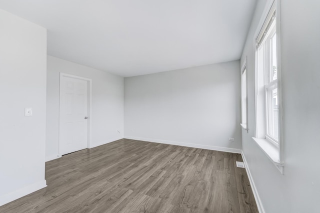 1166 W Cullerton St, Chicago, IL 60608 - spare room featuring wood finished floors and plenty of natural light