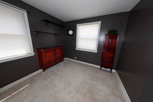 1406 Portsmouth Ave, Westchester, IL 60154 - unfurnished bedroom featuring multiple windows and light carpet