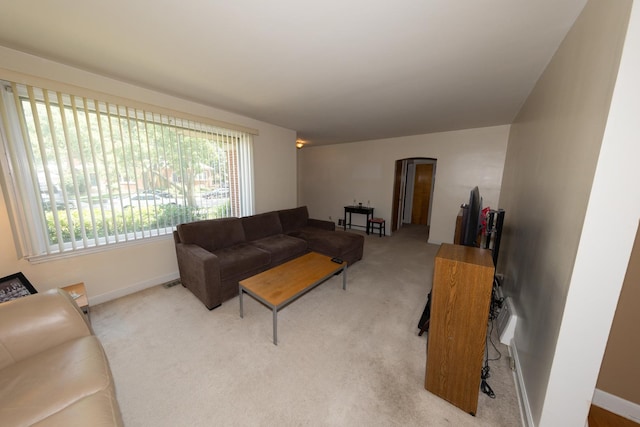 1406 Portsmouth Ave, Westchester, IL 60154 - carpeted living room with arched walkways and baseboards