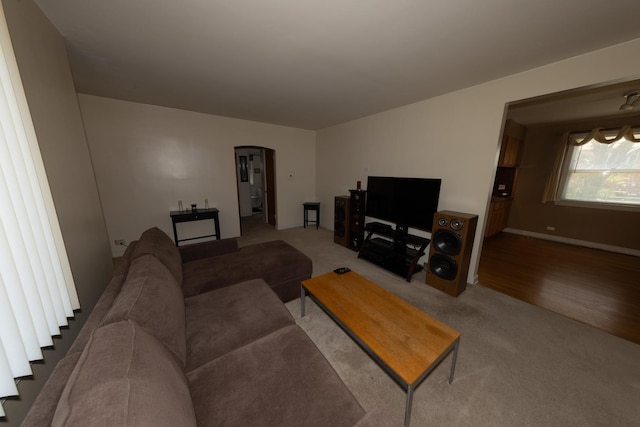 1406 Portsmouth Ave, Westchester, IL 60154 - living room featuring arched walkways and carpet floors