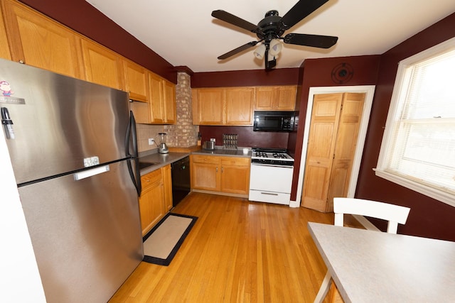 1406 Portsmouth Ave, Westchester, IL 60154 - kitchen with black appliances, a ceiling fan, tasteful backsplash, and light wood-style floors