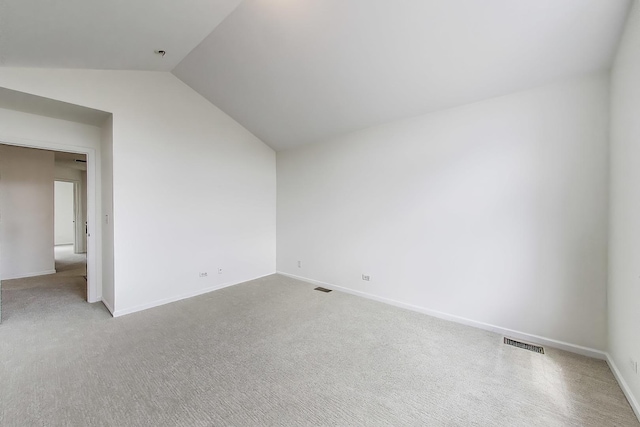 574 S Jade Ln, Round Lake, IL 60073 - unfurnished room featuring lofted ceiling and carpet flooring
