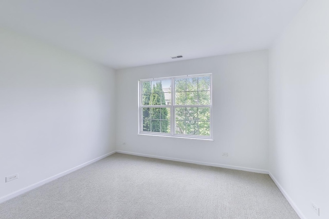 574 S Jade Ln, Round Lake, IL 60073 - unfurnished room with light colored carpet and baseboards