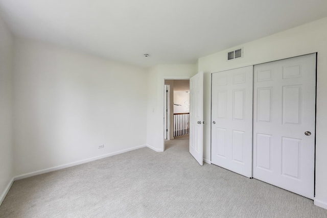 574 S Jade Ln, Round Lake, IL 60073 - unfurnished bedroom featuring light carpet and a closet