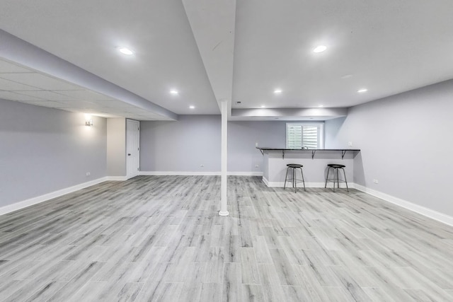 574 S Jade Ln, Round Lake, IL 60073 - basement featuring wood finished floors, recessed lighting, and bar area