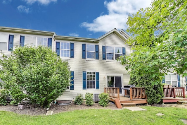 574 S Jade Ln, Round Lake, IL 60073 - back of house featuring a deck and a yard