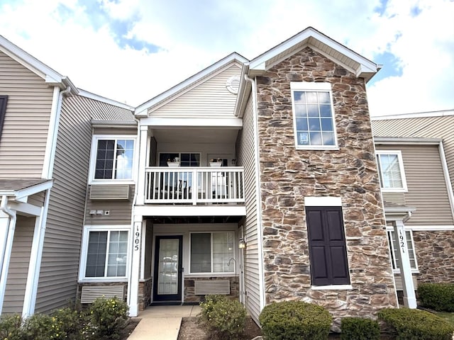 1905 Silverstone Dr Unit 1905, Carpentersville, IL 60110 - traditional home featuring stone siding and a balcony