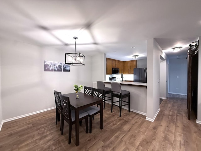 1905 Silverstone Dr Unit 1905, Carpentersville, IL 60110 - dining space with wood finished floors and a chandelier