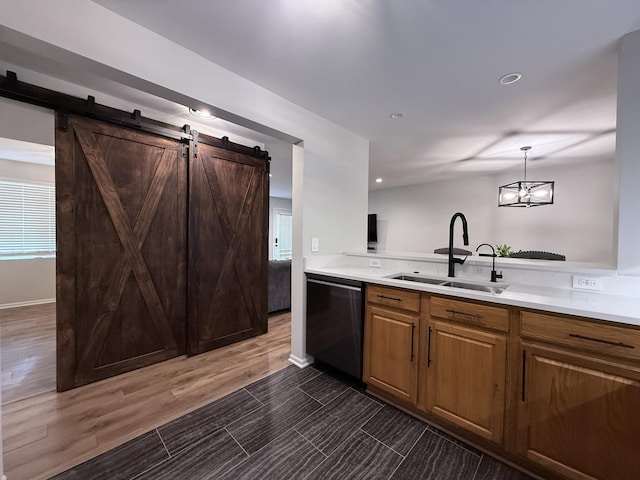 1905 Silverstone Dr Unit 1905, Carpentersville, IL 60110 - kitchen featuring stainless steel dishwasher, light countertops, a barn door, pendant lighting, and recessed lighting