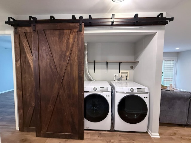 1905 Silverstone Dr Unit 1905, Carpentersville, IL 60110 - laundry room with washing machine and clothes dryer and light wood-style flooring
