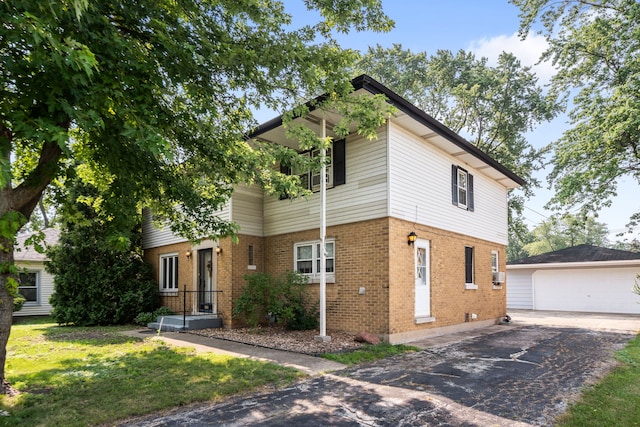 5113 W 79th Pl, Burbank, IL 60459 - traditional-style home featuring an outdoor structure, brick siding, a garage, and a front yard