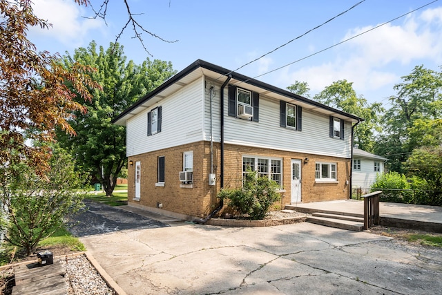 5113 W 79th Pl, Burbank, IL 60459 - colonial-style house featuring brick siding and a patio